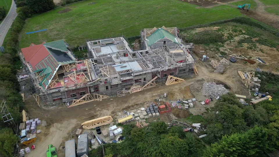 Aerial view of roof structures and the internal layout of a property under construction
