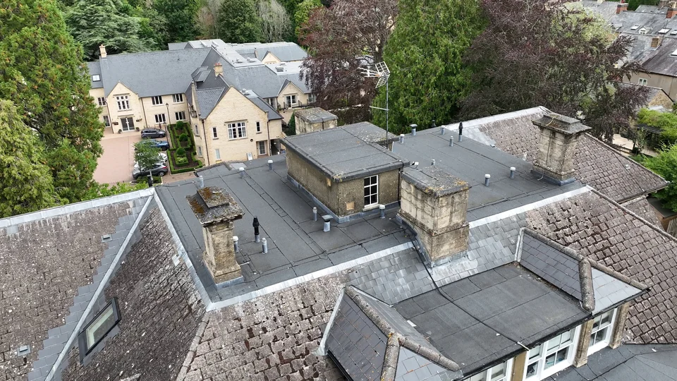 Aerial view of roof slopes, chimney stacks and roof junctions