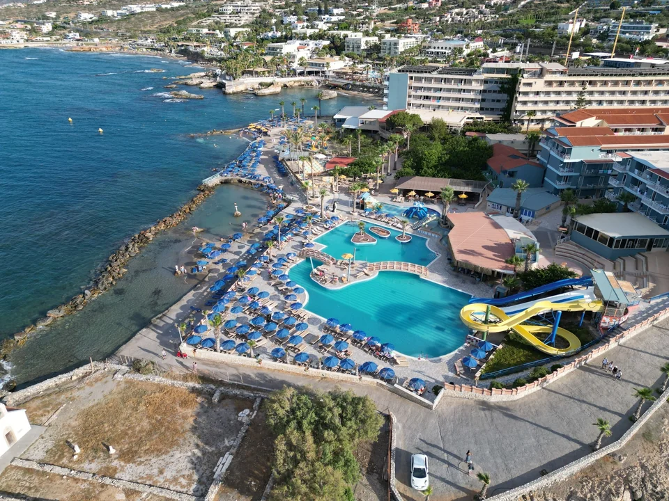 Aerial photograph of a seafront swimming pool complex beside the coast