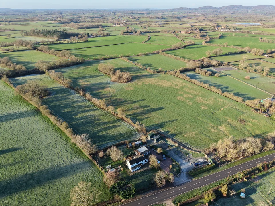 Rural property among fields, hedgerows and country roads
