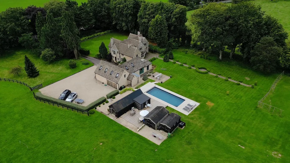 Country property with gardens, outbuildings and a swimming pool